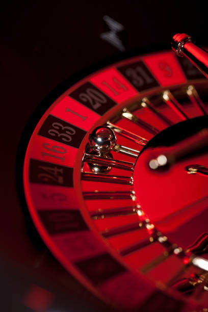 Live dealer studio with roulette wheel and multi-camera setup